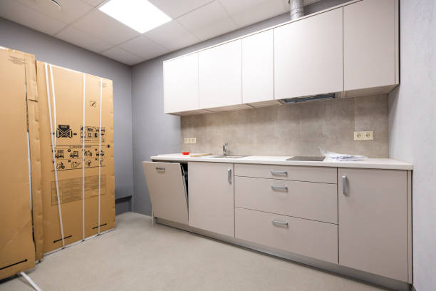 Neutral kitchen with timeless finishes and bold lighting